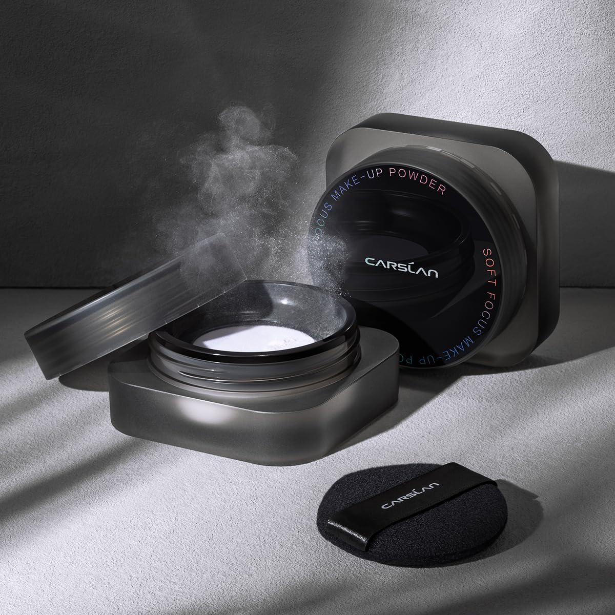 CARSLAN powder in a makeup bag lifestyle shot highlighting travel-ready, longwear benefits