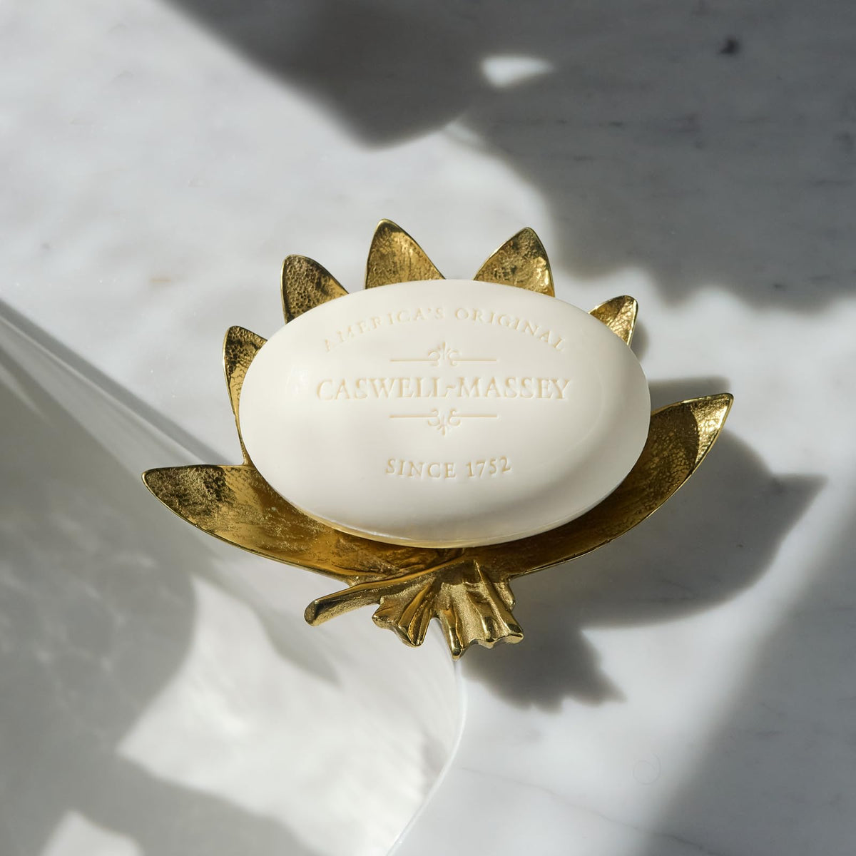 Caswell-Massey creamy lather on palm showcasing rich foam and moisturization