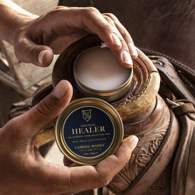 Caswell-Massey tin in a daily bag scene emphasizing convenient on-the-go skin care