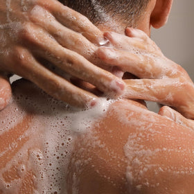 Caswell-Massey soap set in bathroom lifestyle scene adding classic grooming atmosphere benefit
