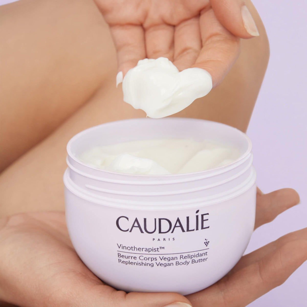 Caudalie body butter on bathroom vanity in lifestyle setting promoting routine use