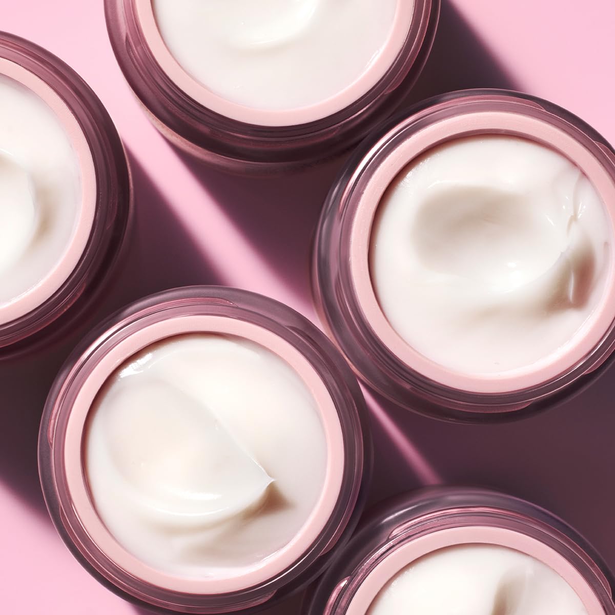 Caudalie jar on bathroom vanity suggesting nightly firming routine