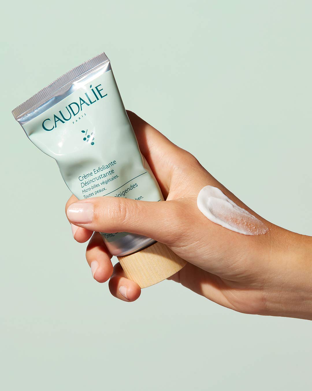 Caudalie Vinoclean application in hand demonstrating gentle exfoliant coverage benefit