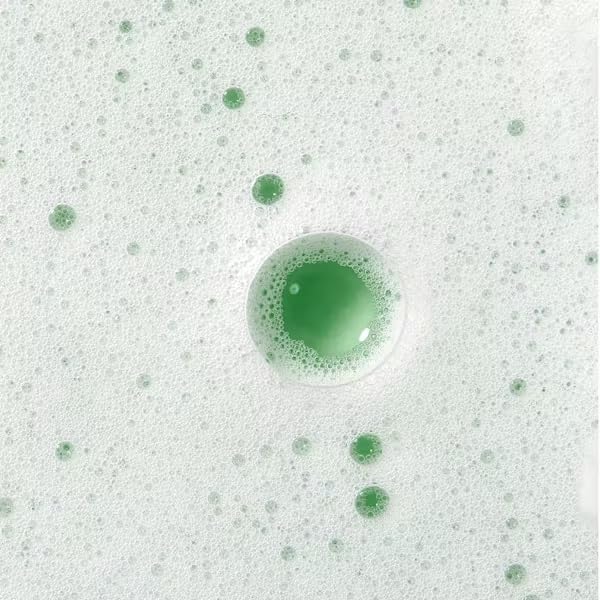 Caudalie cleanser mixed with exfoliator showing creamy whipped texture for gentle exfoliation