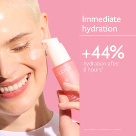 Caudalie bottle held in hand showing 30 mL scale and travel-friendly size