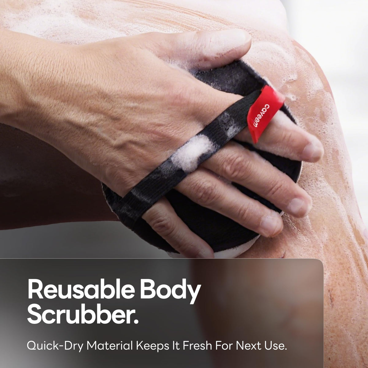 CAVEEM scrubber next to hand for scale showing compact travel-friendly size