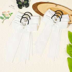 CEELGON bow worn on ponytail demonstrating secure fit during activity