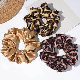 CEELGON scrunchie size compared to hand showing large 6.25-inch scale