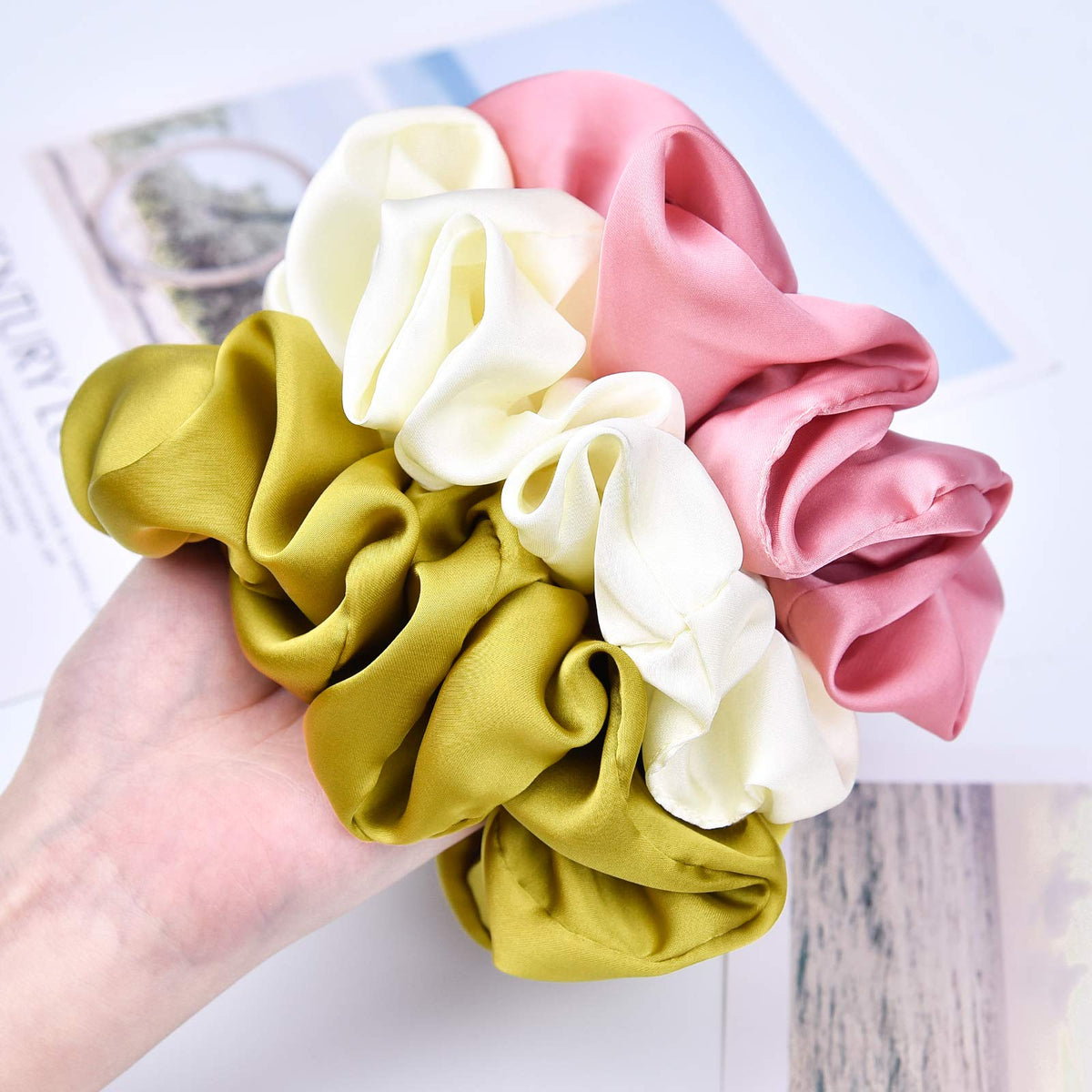 CEELGON scrunchie beside standard elastic showing larger size and gentler pressure benefit