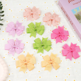 CÉLLOT paired bows arranged in a gift box for present-ready appeal