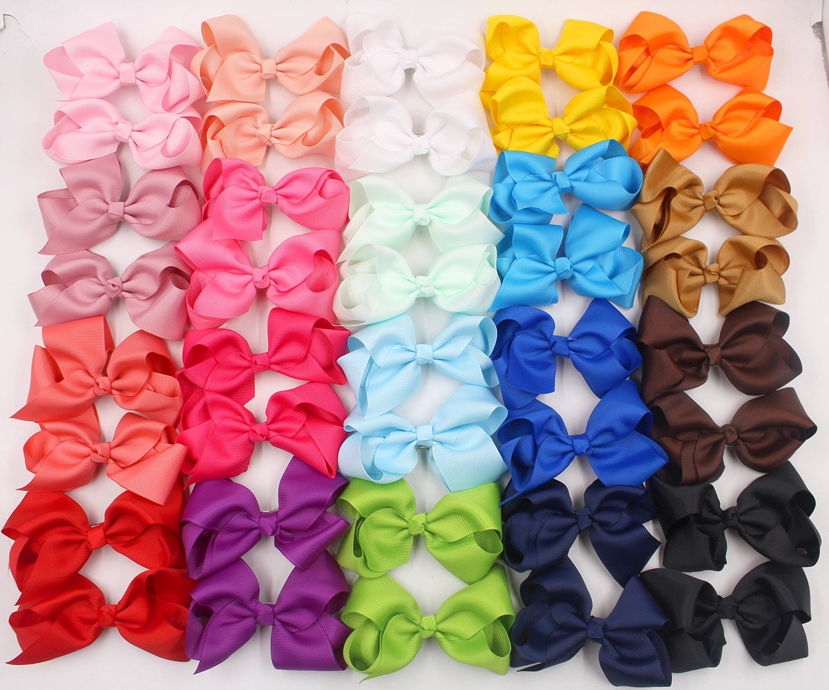 CÉLLOT storage box open with bows organized for neat accessory storage