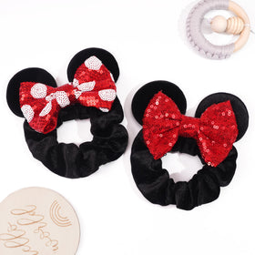 CellElection four assorted color scrunchies laid out to display variety and styling options