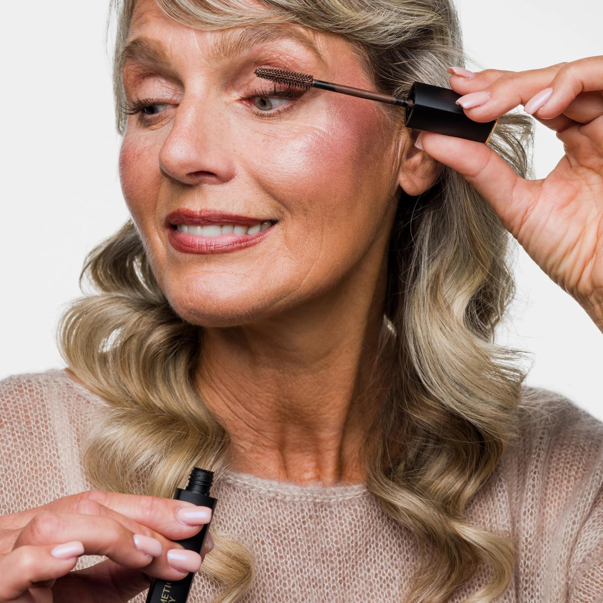 Cellmetics mascara applied on lashes closeup demonstrating lengthening and natural definition