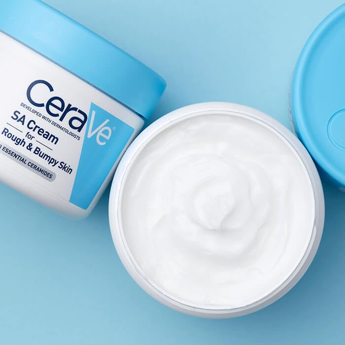 CeraVe cream in hand ready for application to hydrate skin