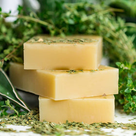 Applying Chagrin Valley shampoo bar to hair for scalp soothing