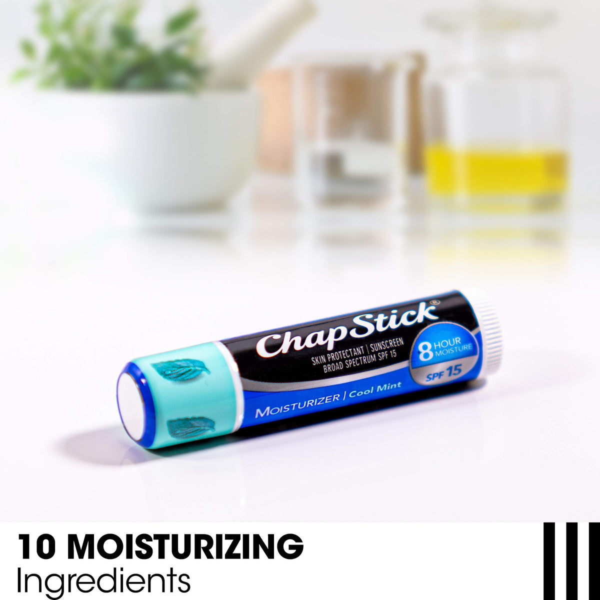 Hand applying ChapStick Cool Mint showing easy use benefit