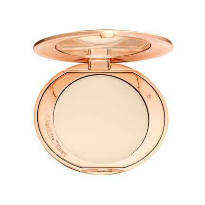 Charlotte Tilbury compact front view showing sleek packaging and travel ready benefit