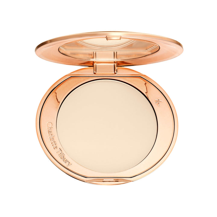 Charlotte Tilbury compact front view showing sleek packaging and travel ready benefit