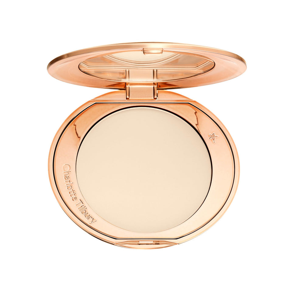 Charlotte Tilbury compact front view showing sleek packaging and travel ready benefit