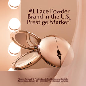 Charlotte Tilbury product applied with brush showing even application and shine control benefit
