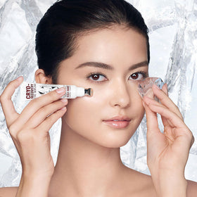 Charlotte Tilbury applicator massaging under-eye to help reduce puffiness