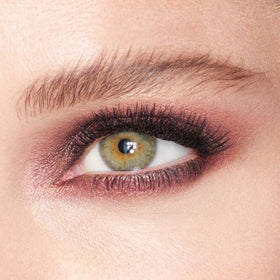 Charlotte Tilbury eyeshadow applied on eyelid demonstrating luminous, buildable finish