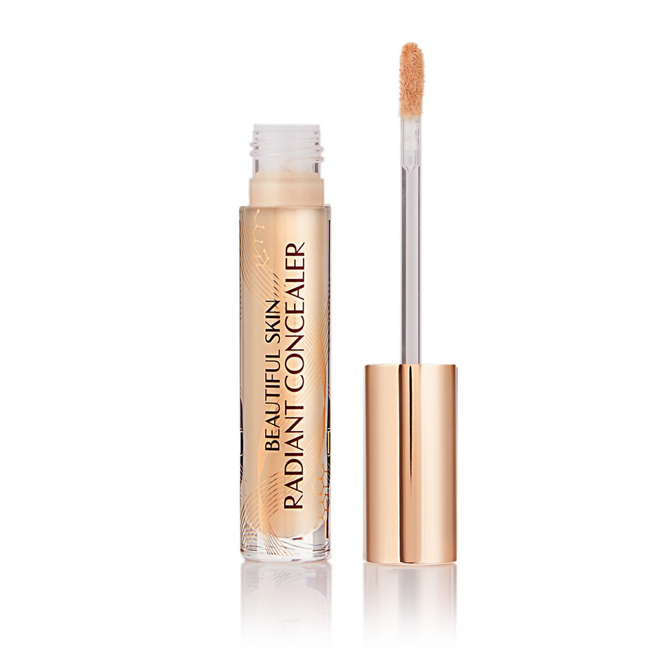 Charlotte Tilbury front packaging showing sleek concealer tube and branding benefit brightening