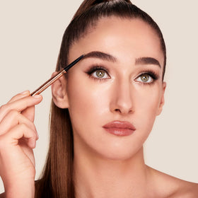 Charlotte Tilbury Brow Cheat applied on model creating defined, natural brows