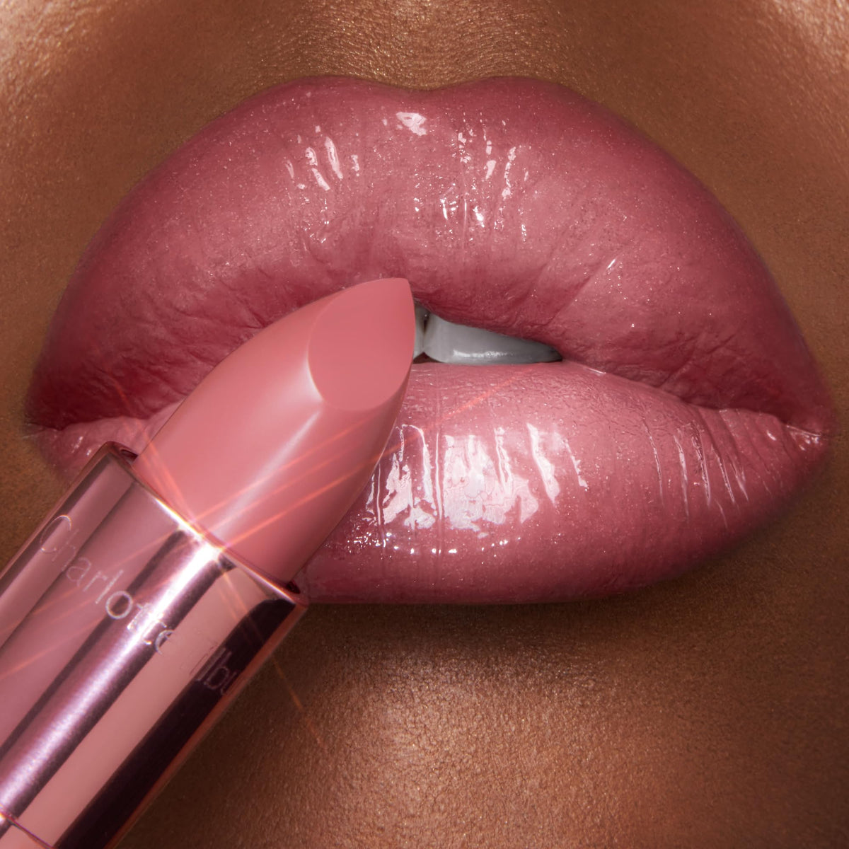 Charlotte Tilbury candy chic paired with Lip Cheat liner to demonstrate shaping and definition