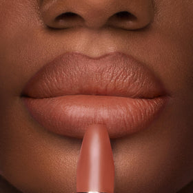 Charlotte Tilbury lipstick applied from hand showing easy, precise application