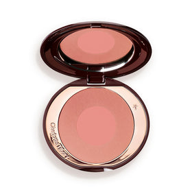 Charlotte Tilbury compact front view showing packaging and benefits
