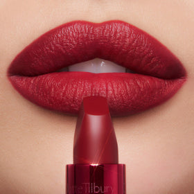 Charlotte Tilbury red metallic tube opened displaying lipstick and premium casing
