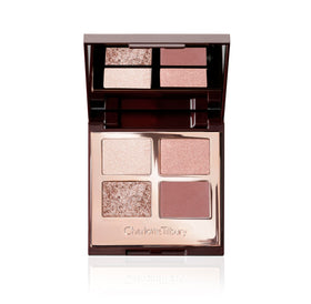 Charlotte Tilbury palette front view showing four rose-gold shades and compact mirror for versatile looks