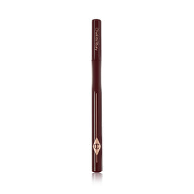 Charlotte Tilbury lifestyle image of flicked eyeliner showing chic, long-wear benefit