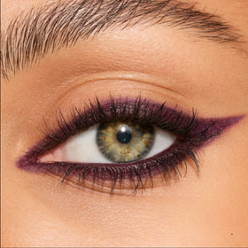 Charlotte Tilbury Fig Smoulder swatch on skin displaying deep claret payoff and blendability