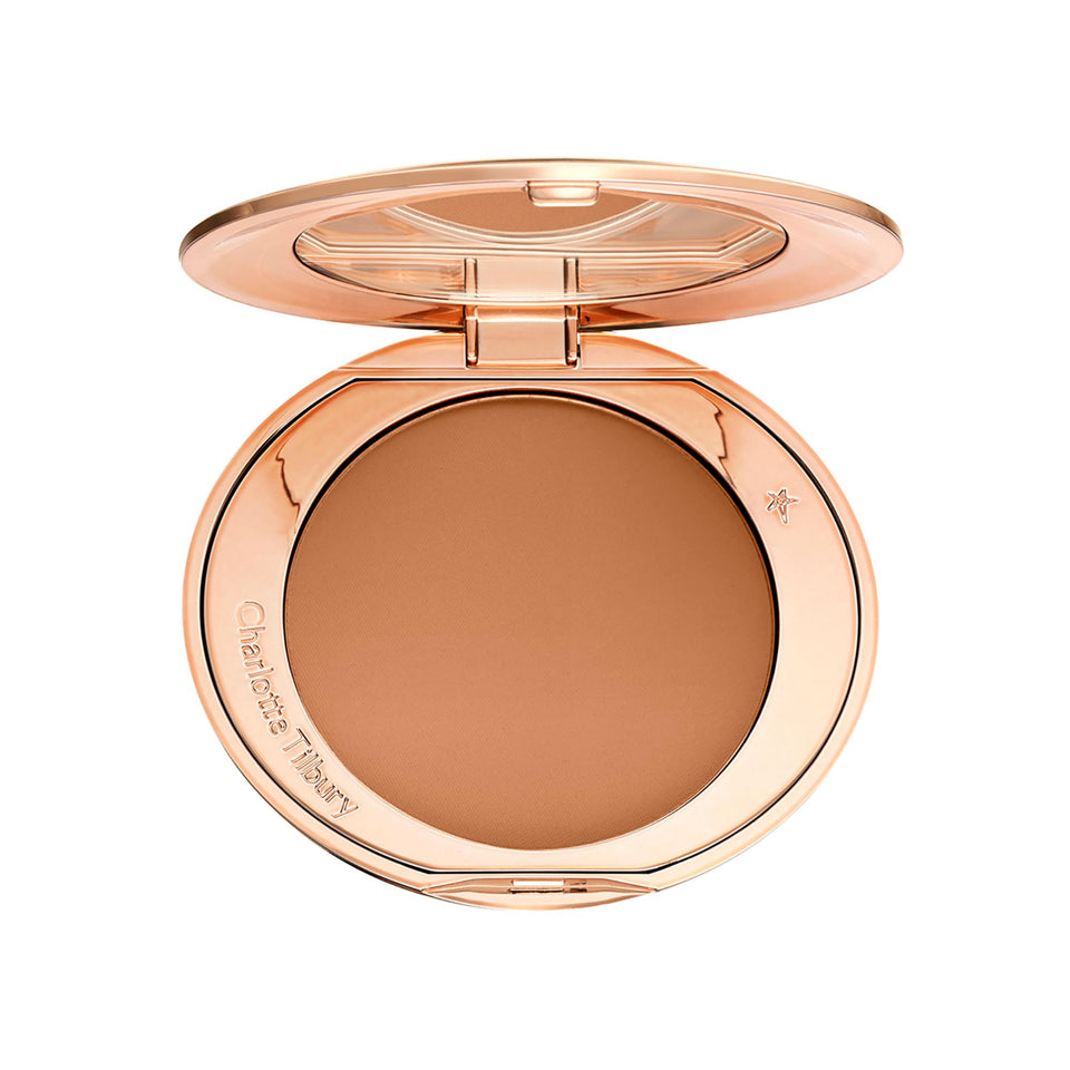 Charlotte Tilbury compact front view showing elegant packaging and travel convenience