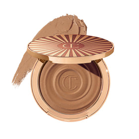Charlotte Tilbury compact front view showing sleek packaging and portable benefit