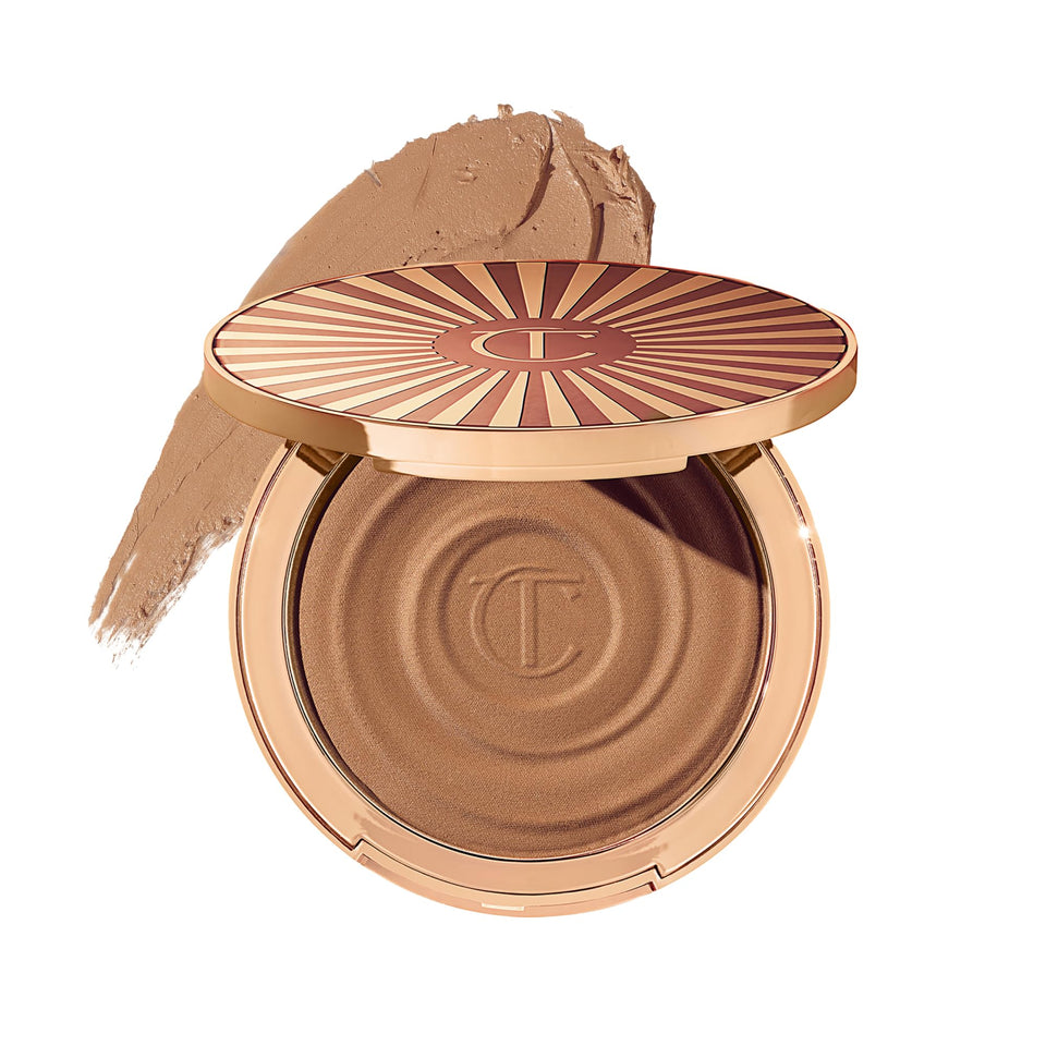 Charlotte Tilbury compact front view showing sleek packaging and portable benefit