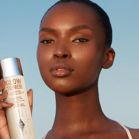 Charlotte Tilbury toner on cotton pad illustrating easy application and gentle exfoliation