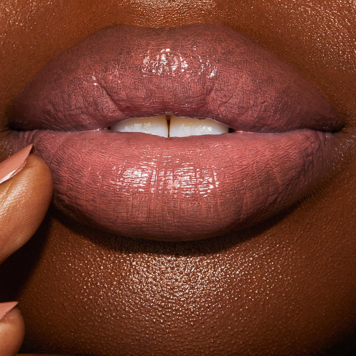 Charlotte Tilbury arm swatch of Pillow Talk shade showing true nude-pink pigment