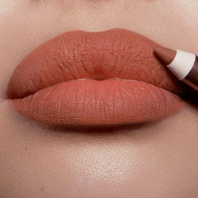 Charlotte Tilbury swatches on arm showing Hot Gossip shade variety and pigmentation