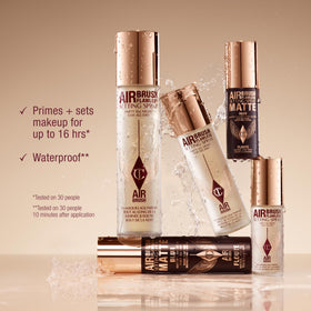 Charlotte Tilbury makeup artist spraying setting mist to lock in look and prevent creasing during application