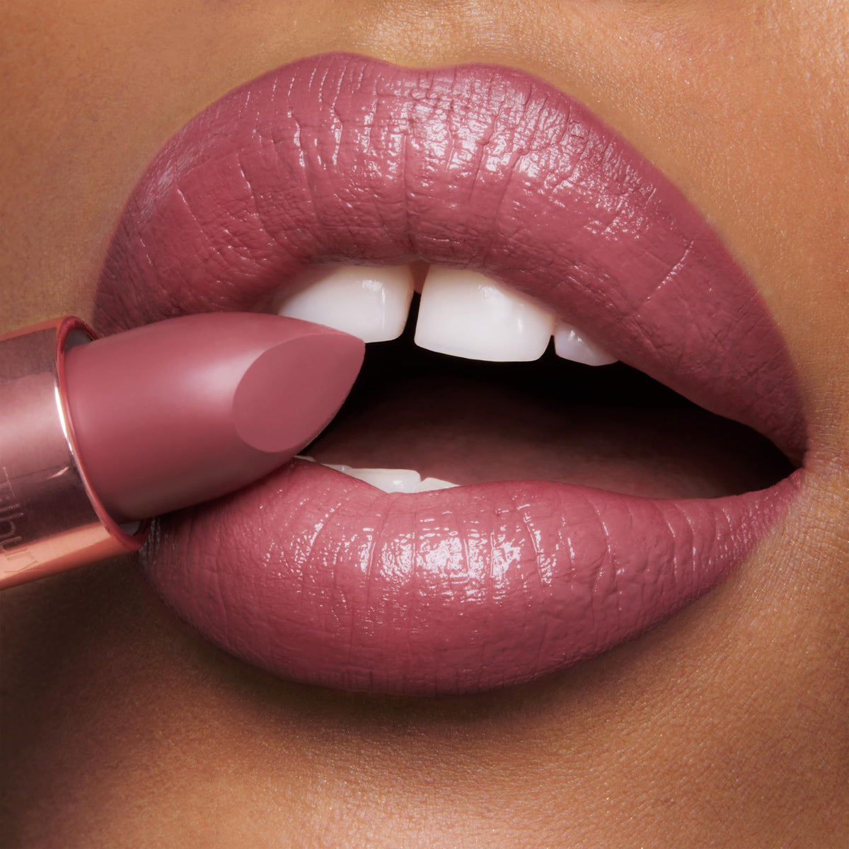 Charlotte Tilbury on-model wearing 90's Pink showing wearable warm rose-pink benefit: flattering everyday color