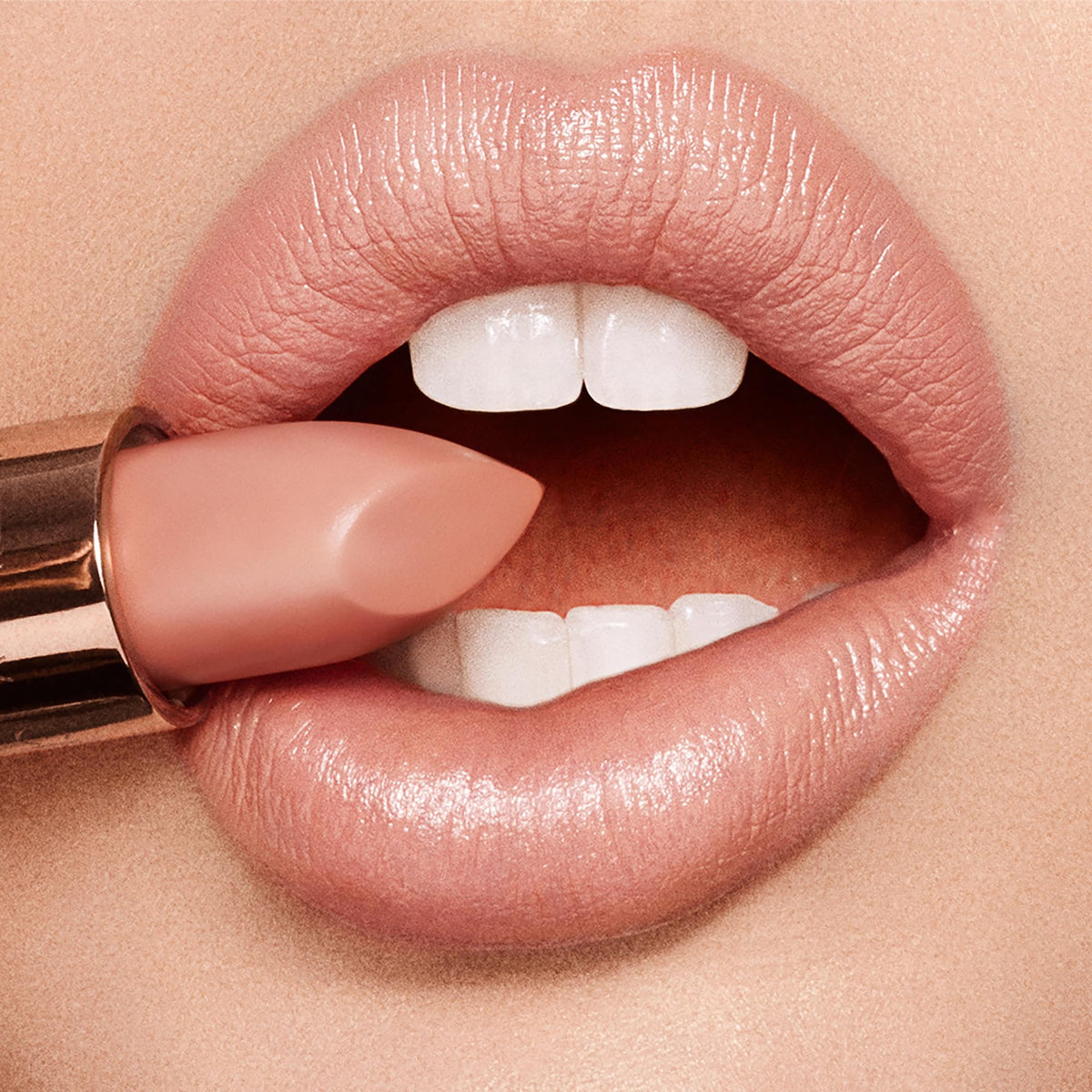 Charlotte Tilbury lipstick texture swipe on skin showing satin finish and luminous effect benefit