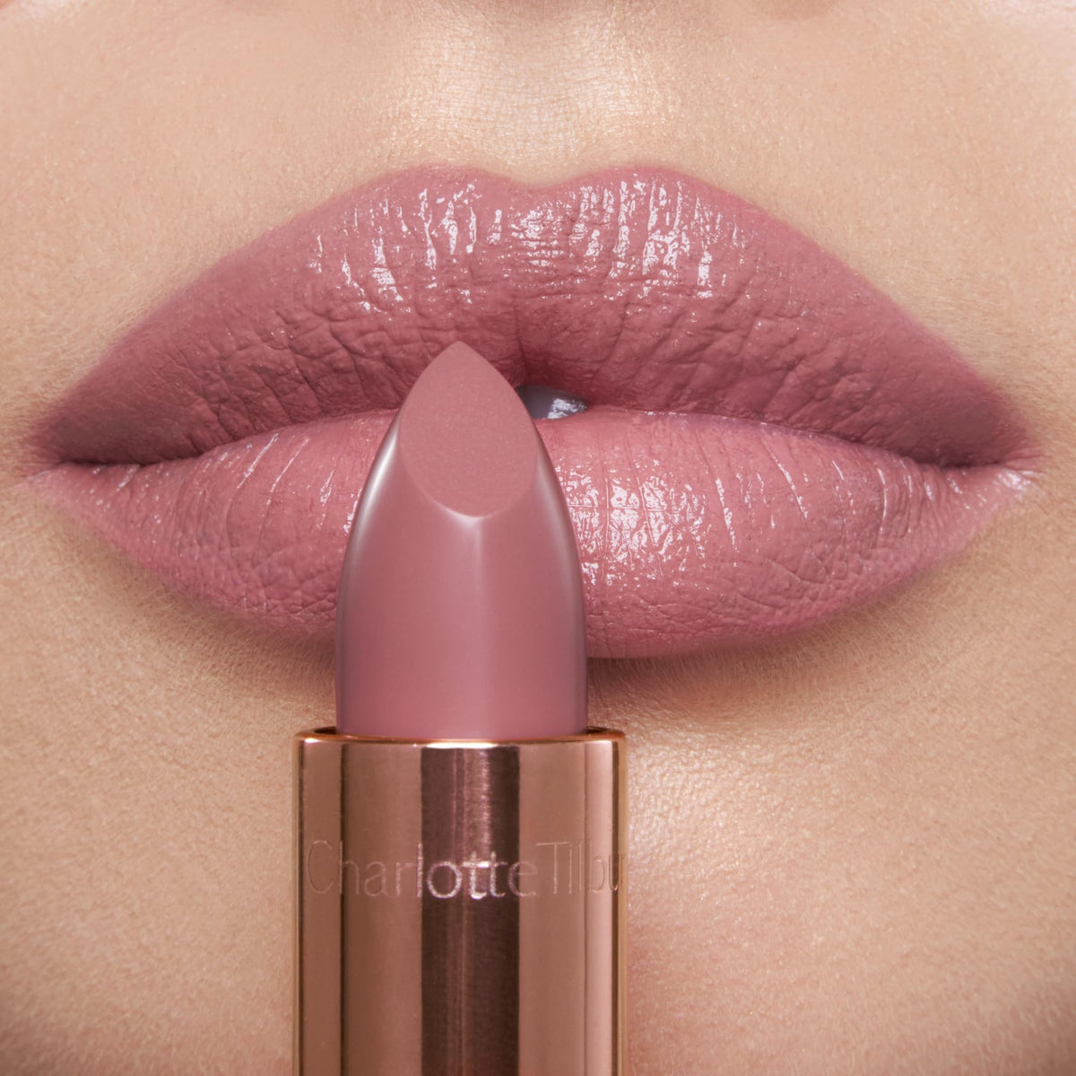 Charlotte Tilbury swatch on hand showing Pillow Talk Fair color payoff and hydration