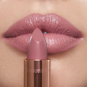 Charlotte Tilbury swatch on hand showing Pillow Talk Fair color payoff and hydration