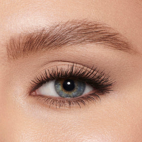 Charlotte Tilbury gel beside brow pencil showing compact travel-friendly size