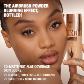 Charlotte Tilbury lifestyle image outdoors showing matte, shine‑controlled finish