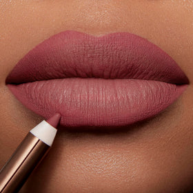 Charlotte Tilbury liner paired with lipstick illustrating enhanced color layering