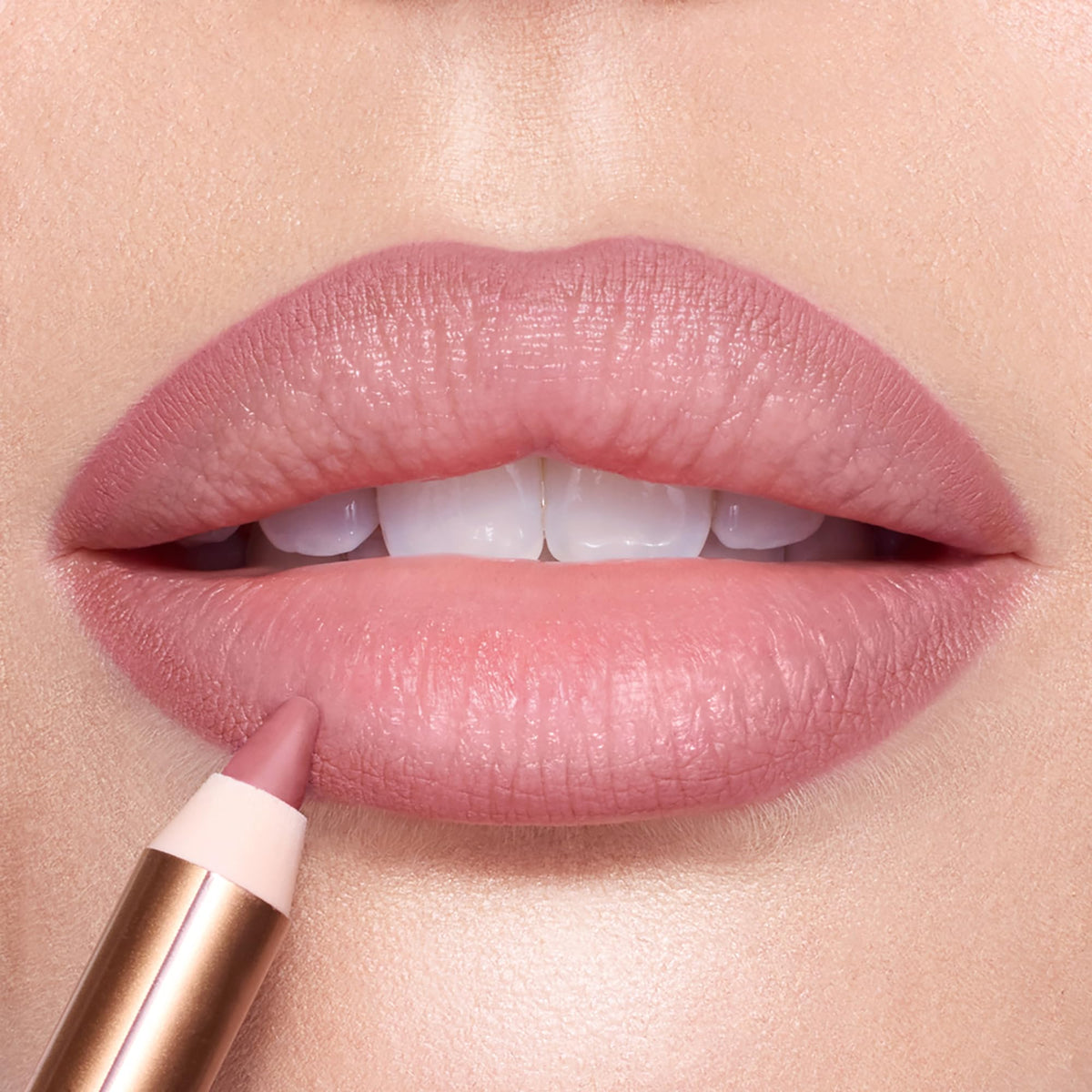 Charlotte Tilbury lip liner applied to lips in use illustrating fuller-looking, natural result